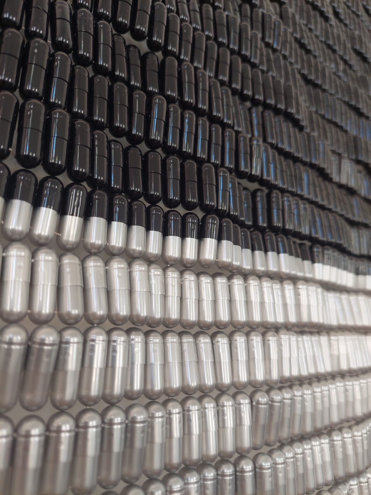 Journey, 2021 — woven gel capsules in black, grey and cream